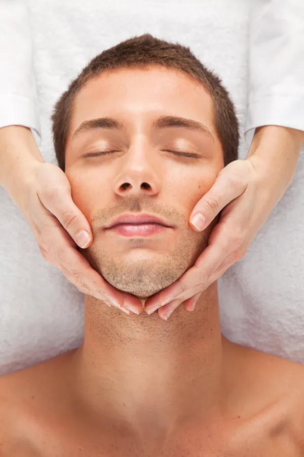 AquaFirmeFacial-Treatment A man lying down receiving an AquaFirme Facial from Regenerative Medical Institute in Greenville.