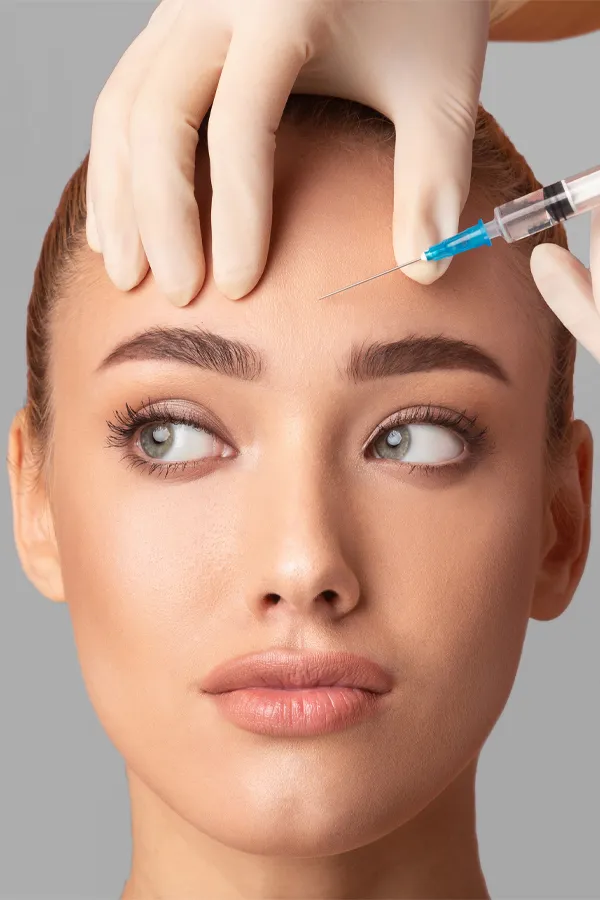 Botox-Treatment Close up of a woman with receiving a Botox injection in her brow from Regenerative Medical Institute in Greenville.