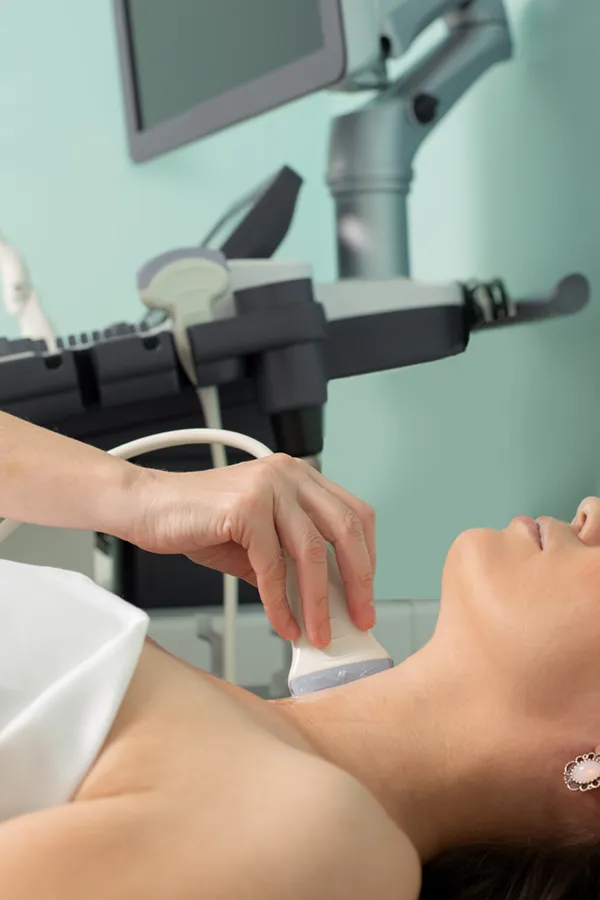 Hashimotos-Thyroiditis-Treatment A woman gets a thyroid scan from a doctor in a clinic. Get help with Hashimoto's Thyroiditis from Regenerative Medical Institute in Greenville.