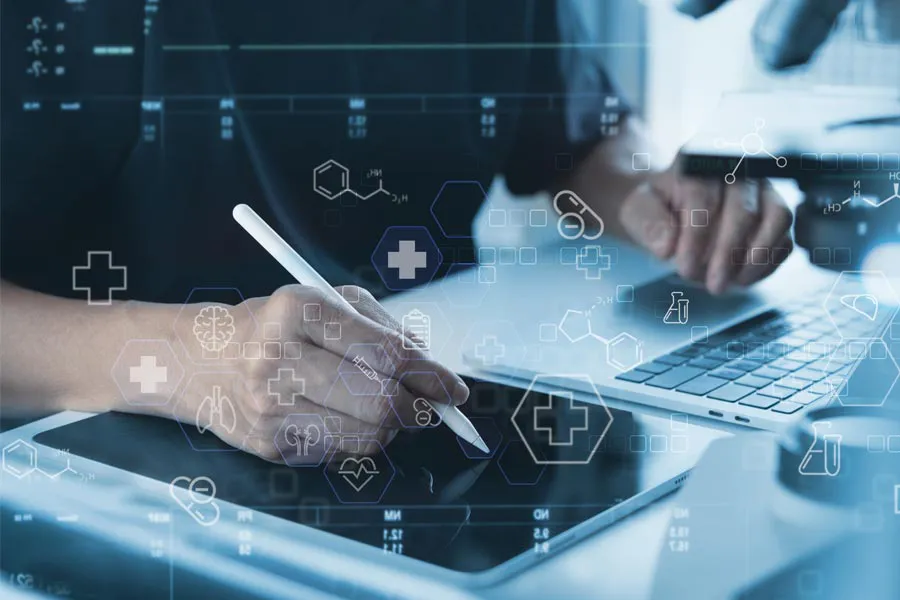 Health-Conditions-Treated-Doctor Close-up of a medical professional using a laptop and tablet, with illustrated medical symbols overlayed on the image, symbolizing health conditions treated by Regenerative Medical Institute in Greenville.