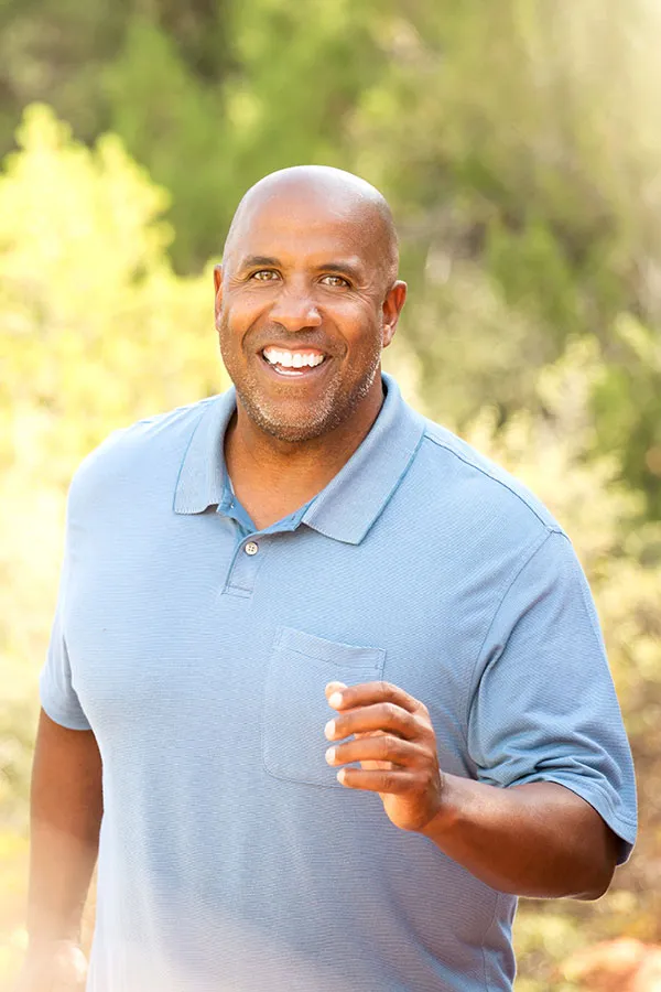 Hydromax-Pump-Treatment A middle-aged black man happily runs outdoors. Get Hydromax Pump for penis enlargement treatment from Regenerative Medical Institute in Greenville.